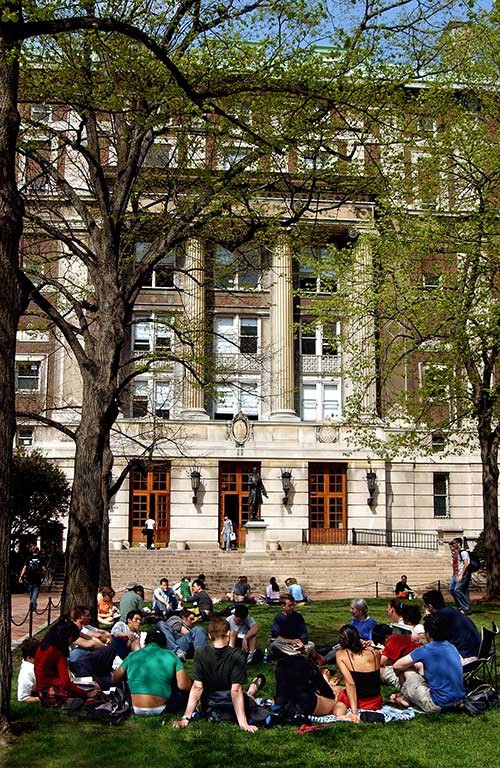 photo of students on lawn in front of Pulitzer Hall