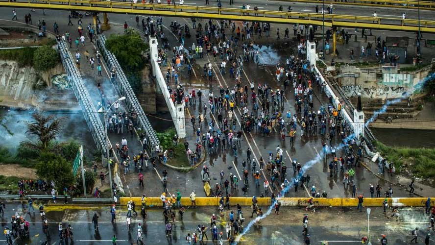 scenes of a protest in Venezuela in 2018